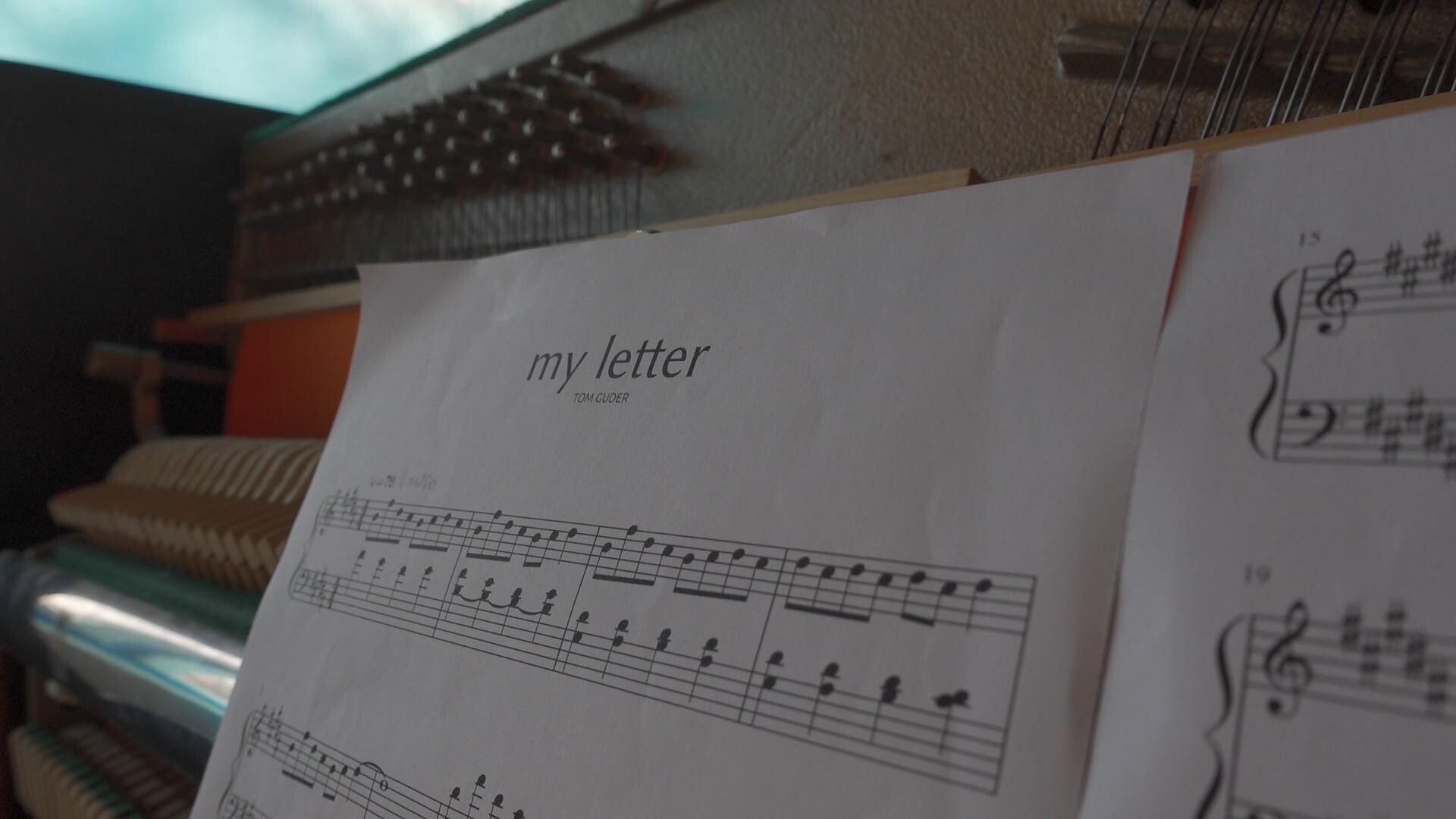 Sheet music titled my letter by Tom Guder, displayed alongside musical notation.